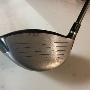 golf clubs with tee marks