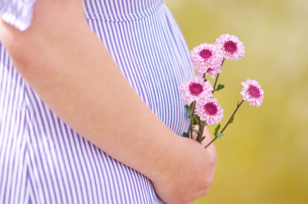 Pregnant belly and a flower.