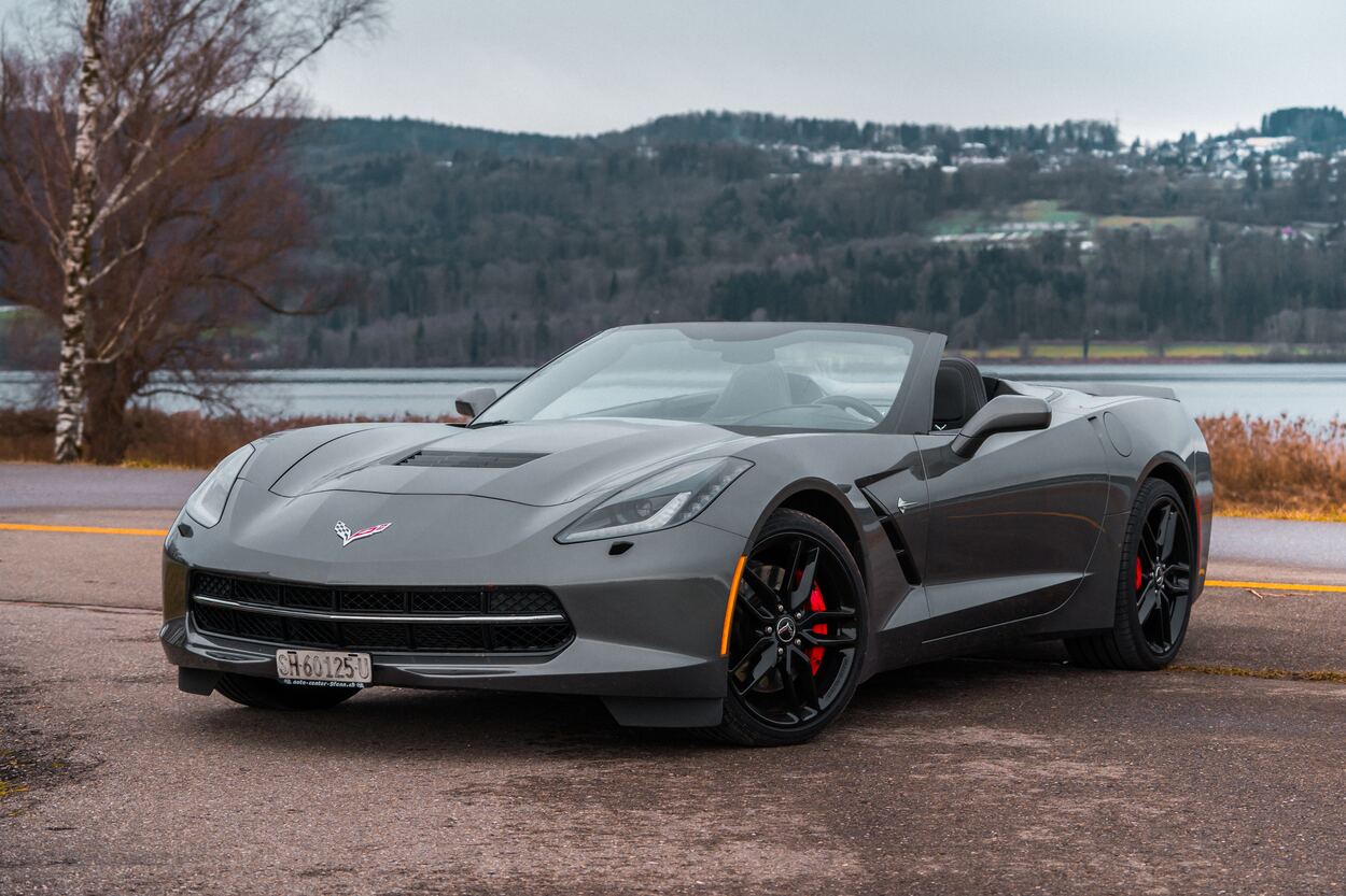 Golf clubs fit in a Chevrolet Corvette like this black model 