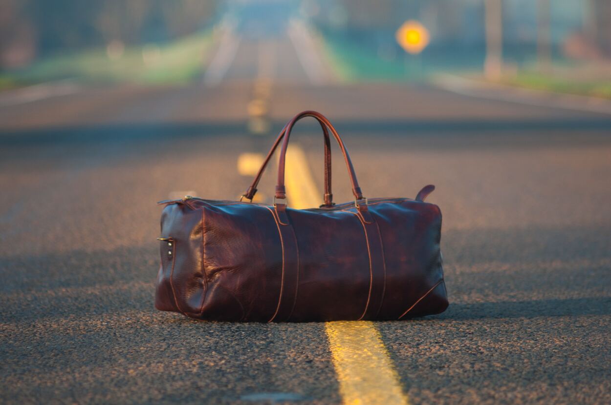 Brown carry bag in a road.