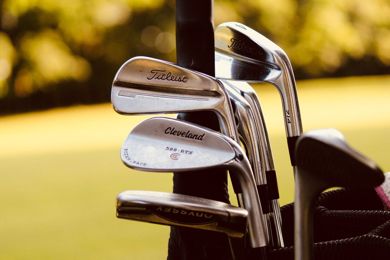 Different brand of golf clubs.